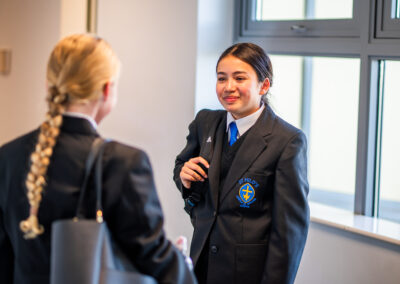 Pupils stood having a conversation at St Hild's CofE School